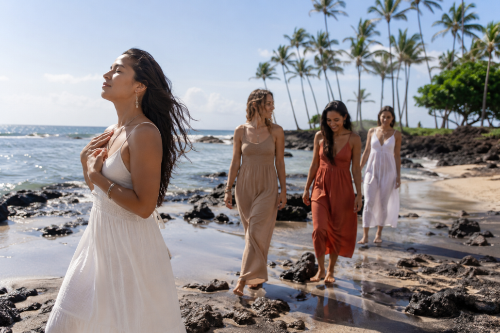 women walking on the beach on the big Island
